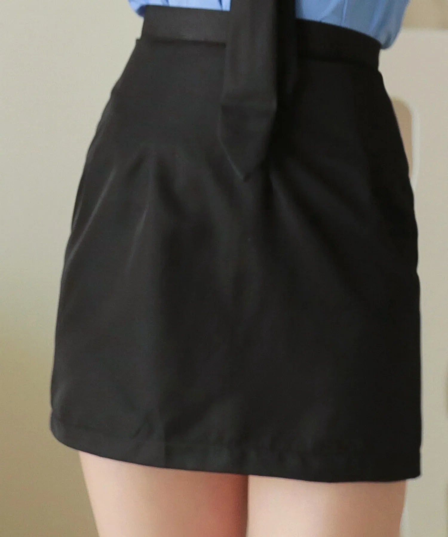 Saxe-colored police in trapezoidal mini skirt