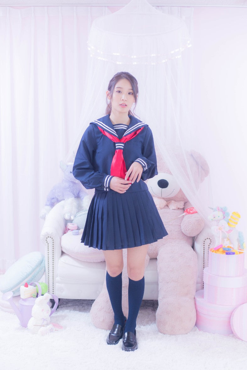 Navy blue sailor suit with long sleeves and red scarf