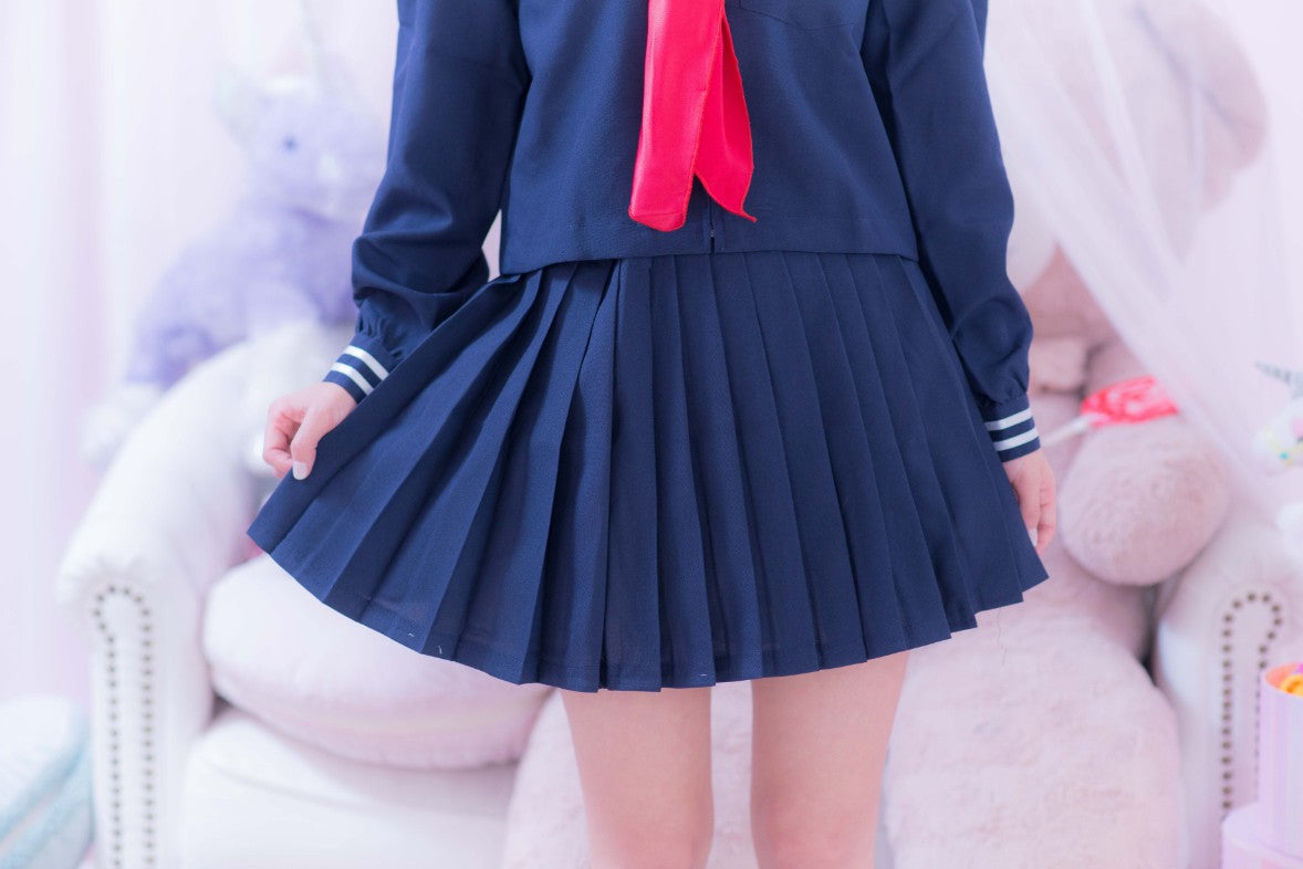 Navy blue sailor suit with long sleeves and red scarf