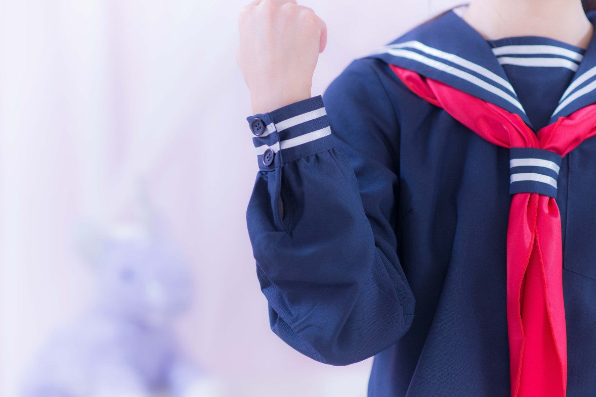 Navy blue sailor suit with long sleeves and red scarf