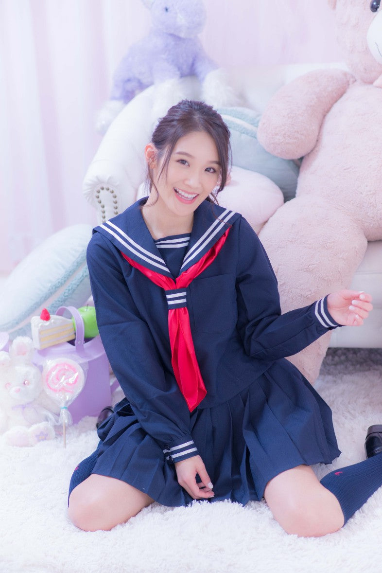 Navy blue sailor suit with long sleeves and red scarf