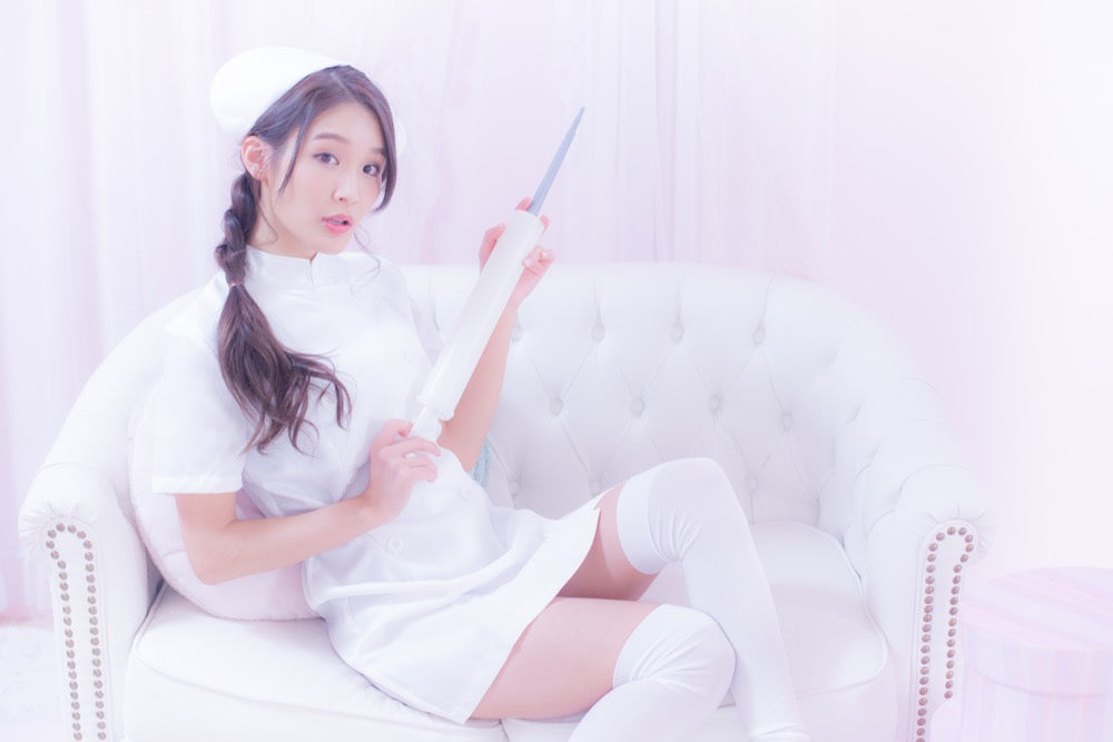 White nurse with large syringe